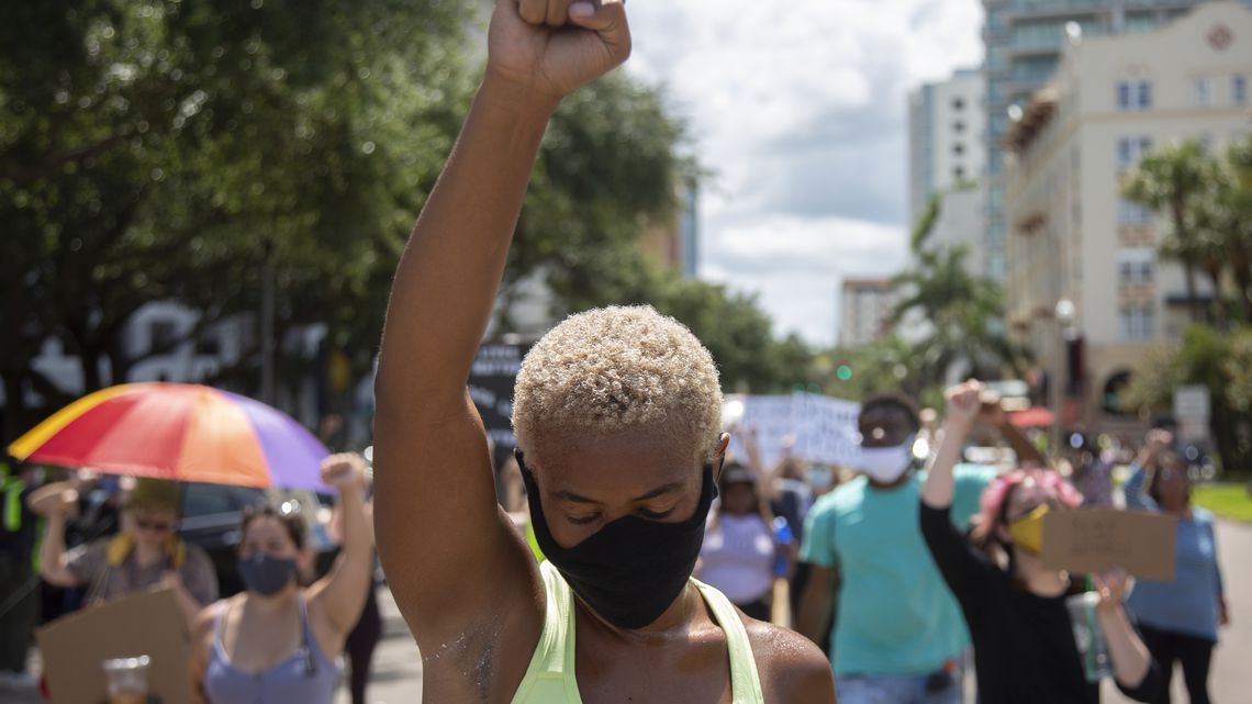 Tiffany Taylor, 24, raises her fist during protests in St. Petersburg Sunday, June 14, 2020. [PENDYGRAFT | Times]